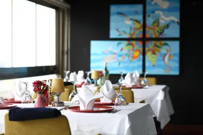 a dining room with two tables with white tablecloths at Antik Hotel Istanbul in Istanbul