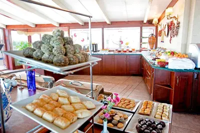a kitchen with many different types of food on display at Hippodrome Hotel in Istanbul