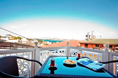 a table with a plate of food on a balcony at Hippodrome Hotel in Istanbul