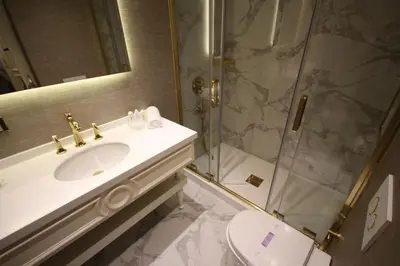 a bathroom with a sink and a shower and a toilet at Mina Hotel - Special Category in Istanbul