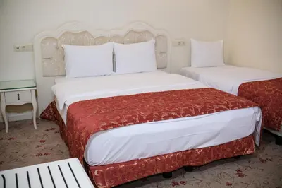 a hotel room with two beds and a table at The And Hotel Sultanahmet - Special Category in Istanbul
