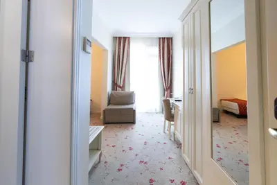 a corridor of a hotel room with a bedroom at The And Hotel Sultanahmet - Special Category in Istanbul