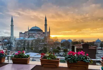 a view of a mosque with flowers in pots at The And Hotel Sultanahmet - Special Category in Istanbul