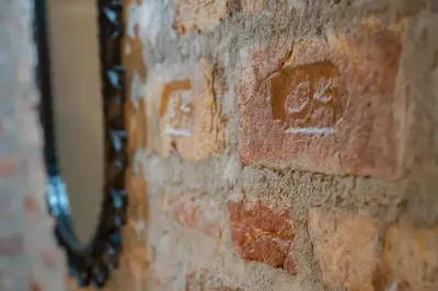 a brick wall with a chain on it at Hotel Niles Istanbul in Istanbul