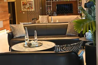 a living room with a couch and a table at Sogut Hotel Old City in Istanbul