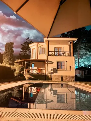 a house and a swimming pool in front of a house at Ihlamurlu Home in Sapanca