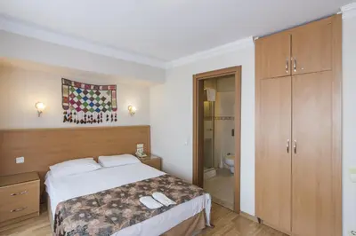 a bedroom with a bed and a bathroom at Deniz Houses in Istanbul