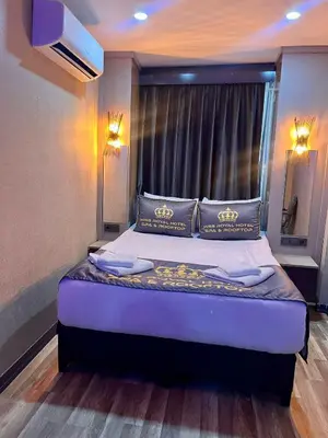 a bedroom with a bed with a large window at Miss Royal Hotel & SPA in Istanbul