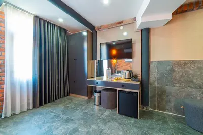 a bathroom with a counter with a sink and a mirror at Miss Royal Hotel & SPA in Istanbul