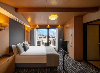 a hotel room with a bed and a television at Tan Hotel - Special Category in Istanbul