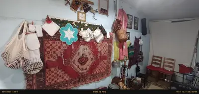 a room with a wall with a rug on the wall at Nur home1 in Istanbul