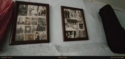 two framed pictures of people on a wall at Nur home1 in Istanbul