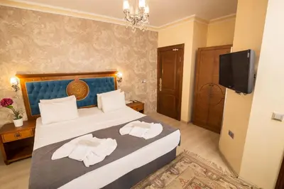 a hotel room with a bed with towels on it at A'la Sofia Hotel İstanbul in Istanbul