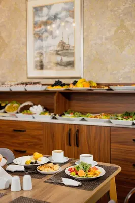 a table with many plates of food on it at A'la Sofia Hotel İstanbul in Istanbul
