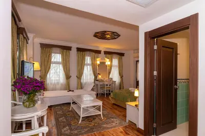 a living room with a bedroom and a bed and a room at Arena Hotel - Special Class in Istanbul