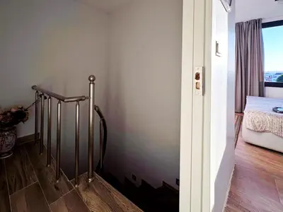 a room with a stairway with a bed and a window at Sultan Pier Hotel in Istanbul