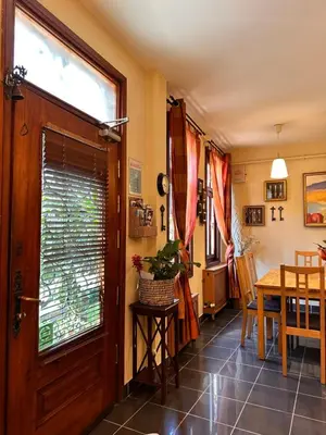 a dining room with a wooden door and a table at Ahmet Efendi Evi in Istanbul