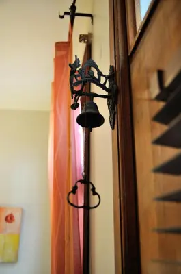 a bell hanging on a wall next to a door at Ahmet Efendi Evi in Istanbul