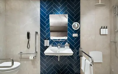 a bathroom with a sink and a toilet at Crowne Plaza Istanbul - Ortakoy Bosphorus by IHG in Istanbul