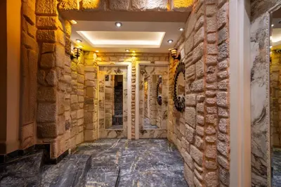 a room with a brick wall and a corridor at REN PLUS SUITES in Istanbul