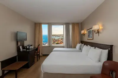 a hotel room with two beds and a window at Pera Rose Hotel & Spa - Special Category in Istanbul