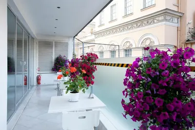 a room with two vases of flowers and a building at Richmond Istanbul in Istanbul
