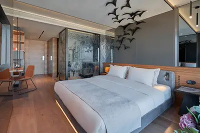 a bedroom with a large bed with bats on the wall at Richmond Istanbul in Istanbul
