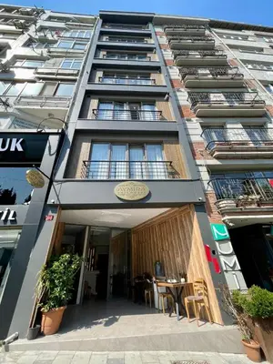 a tall building with a table in front of it at Aymira Suite Hotel in Istanbul