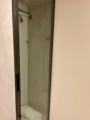 a glass shower in a bathroom with a towel at Aymira Suite Hotel in Istanbul