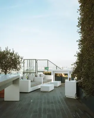 a living room with white furniture on a building at The Marmara Pera in Istanbul