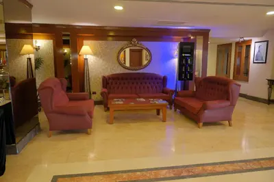 a living room with two couches and a coffee table at The Green Park Bostancı in Istanbul