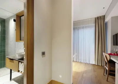 a kitchen and living room with a sink and a table at Galata Rasso Hotel in Istanbul