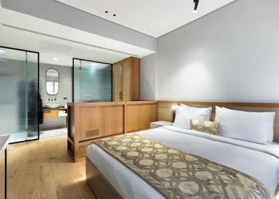a bedroom with a large bed and a bathroom at Galata Rasso Hotel in Istanbul