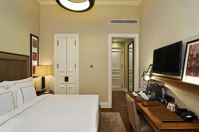 a hotel room with a bed and a television at The Bank Hotel Istanbul, a Member of Design Hotels in Istanbul