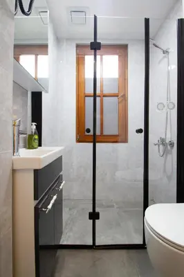 a bathroom with a shower and a sink and a toilet at Turna Hotel in Istanbul