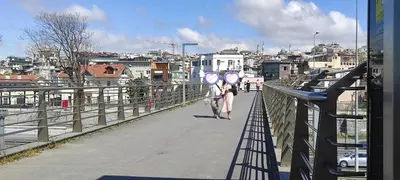 a person riding a bike on a bridge at fafsuitehome in Istanbul