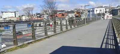 a bridge over a river with a city in the background at fafsuitehome in Istanbul