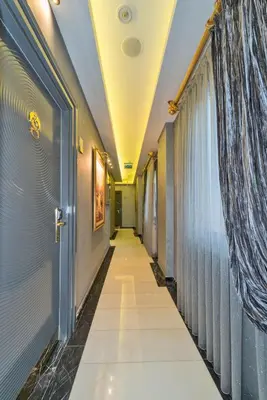 a corridor in a hospital with a door and a window at The Million Stone Hotel - Special Category in Istanbul