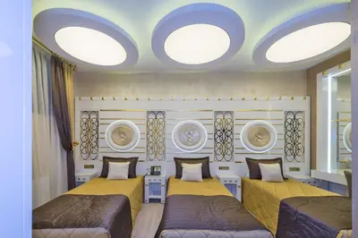 a bedroom with two beds and two windows at The Million Stone Hotel - Special Category in Istanbul