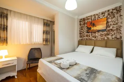 a bedroom with a bed and a desk and a chair at Blue Mosq- Three Storey Detached Villa in Istanbul