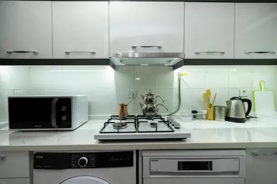 a kitchen with a stove and a microwave at Blue Mosq- Three Storey Detached Villa in Istanbul