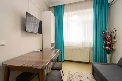 a living room with a desk and a couch at Blue Mosq- Three Storey Detached Villa in Istanbul