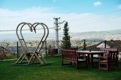 a couple of chairs and a table with a sculpture at Kartepe LOFT in Kartepe
