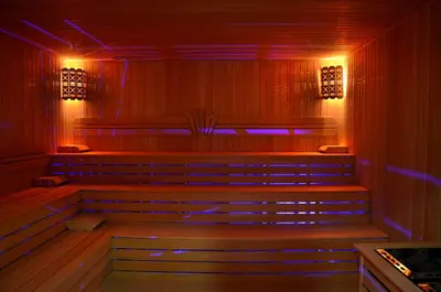 a row of benches in a room with red and blue lights at Çınarpark Hotel in Korfez