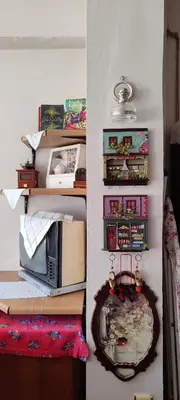 a room with a wall with shelves and a table at Nur home 2 in Istanbul