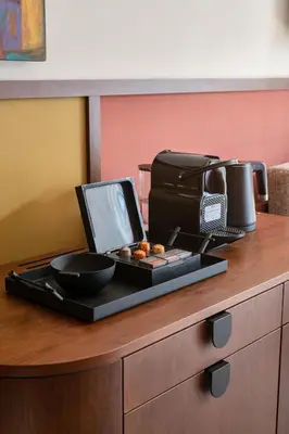 a table with a plate of food and a printer at GentleTom in Istanbul
