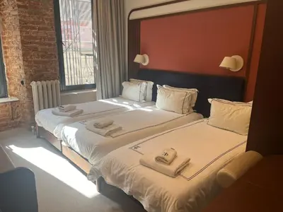 two beds in a hotel room with towels on them at GentleTom in Istanbul