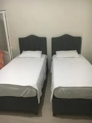 two beds sitting next to each other in a room at Canan’s apartment in Istanbul