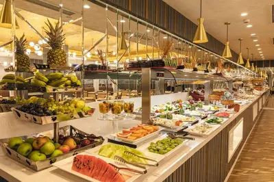 a buffet line with a lot of fruits and vegetables at Mukarnas Pera Hotel in Istanbul