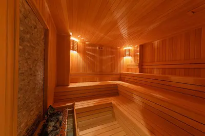 a sauna with wooden walls and wooden flooring at Mukarnas Pera Hotel in Istanbul